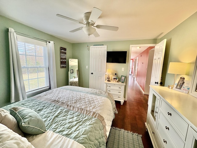 16 Caron Dr, Howland, ME 04448 - bedroom featuring dark wood finished floors, baseboards, and ceiling fan