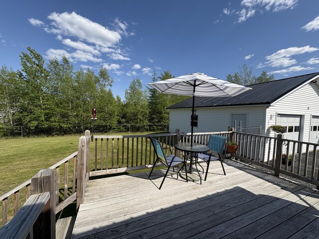 16 Caron Dr, Howland, ME 04448 - wooden terrace featuring a lawn and a garage