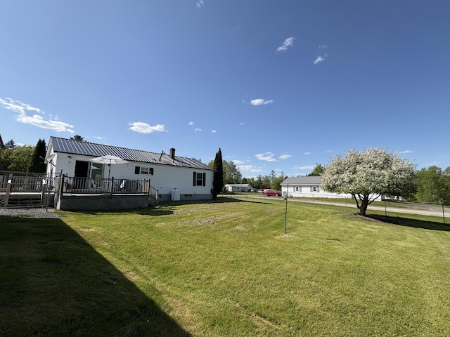 16 Caron Dr, Howland, ME 04448 - view of grassy yard featuring a wooden deck