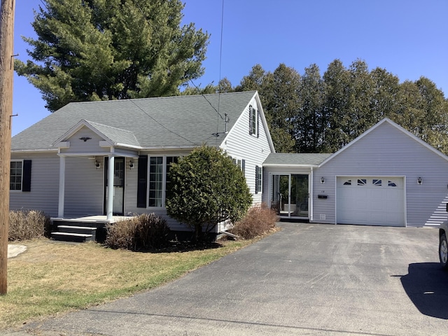 15 Blaine St, Fort Fairfield, ME 04742 - ranch-style house with a garage, covered porch, driveway, roof with shingles, and a front lawn