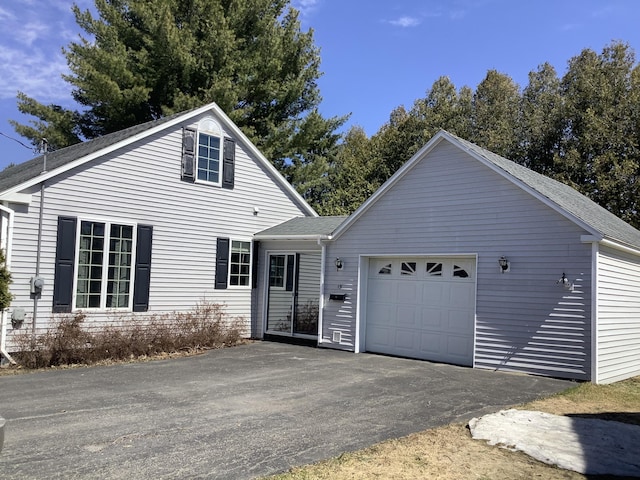 15 Blaine St, Fort Fairfield, ME 04742 - view of front of property featuring driveway, a garage, and roof with shingles