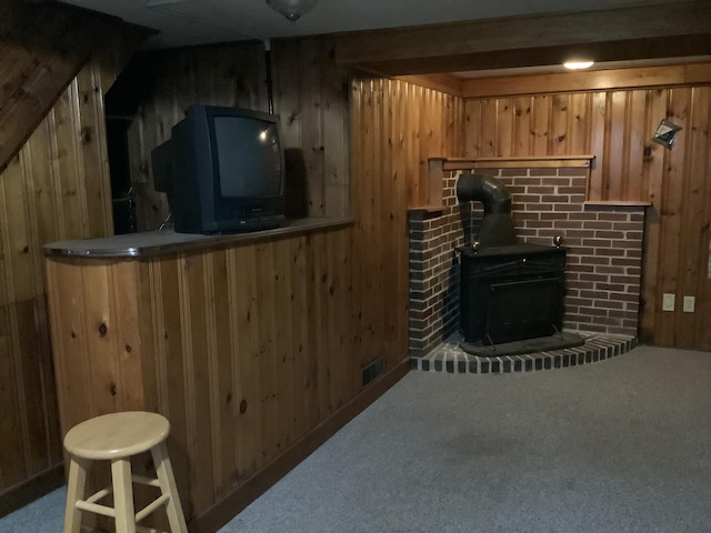 15 Blaine St, Fort Fairfield, ME 04742 - bar featuring wooden walls, carpet, and a wood stove