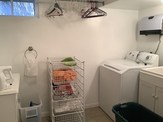 15 Blaine St, Fort Fairfield, ME 04742 - laundry room featuring washer / dryer, cabinet space, and light tile patterned floors