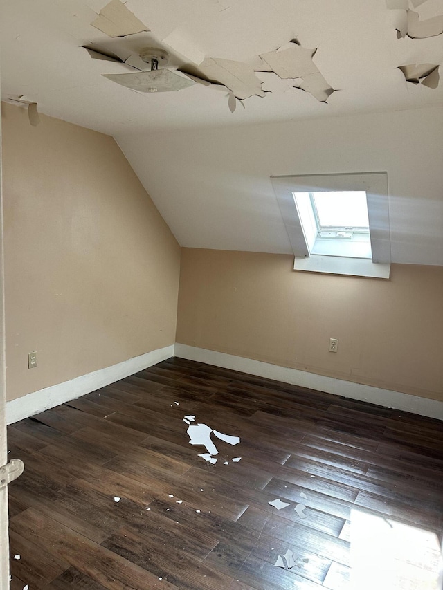 163 Court St, Bangor, ME 04401 - bonus room featuring dark wood finished floors, vaulted ceiling, and baseboards
