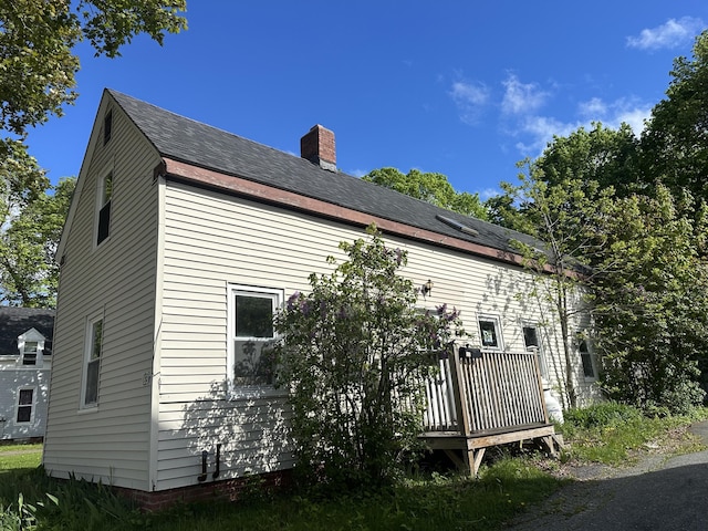 163 Court St, Bangor, ME 04401 - view of property exterior featuring a wooden deck, a chimney, and a shingled roof