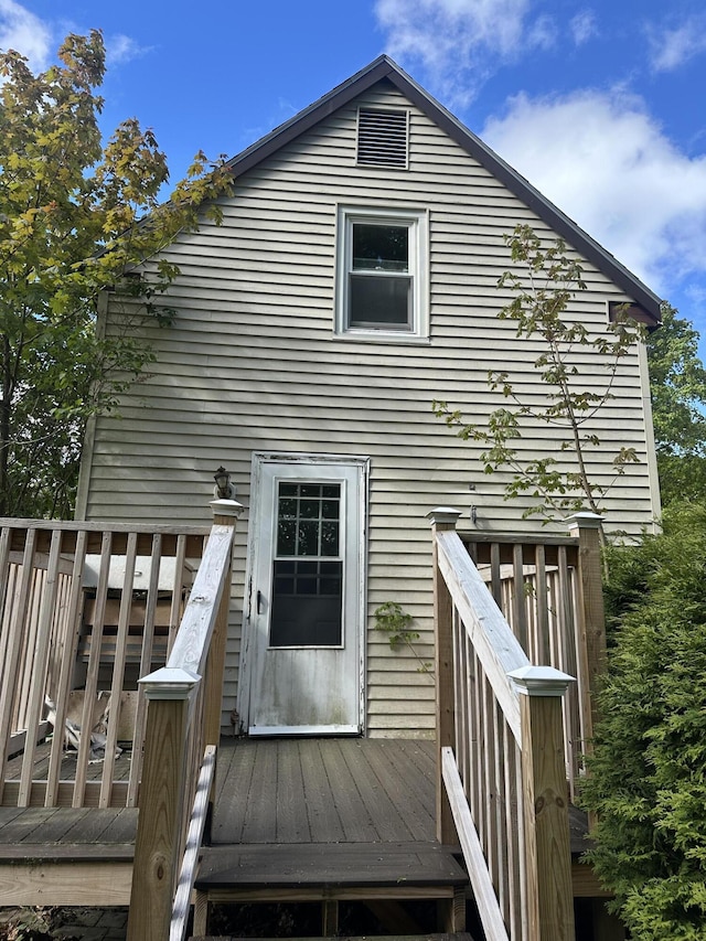 163 Court St, Bangor, ME 04401 - rear view of house with a wooden deck