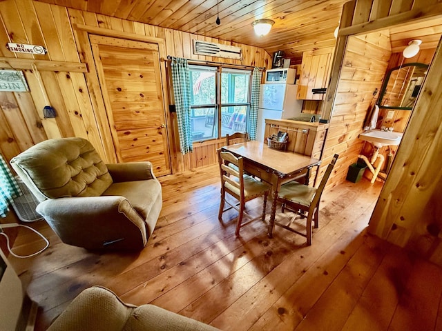 15 Wilson Pond Rd (Hedgehog), Unit Hedgehog Greenville, ME 04441 - dining space featuring hardwood / wood-style flooring, wood walls, and wooden ceiling