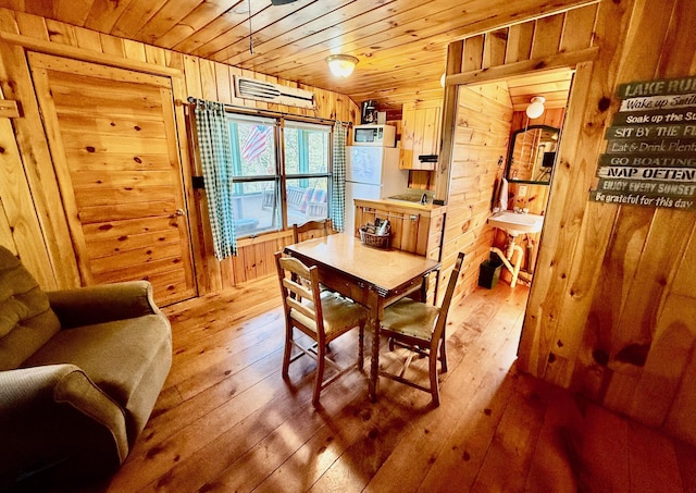 15 Wilson Pond Rd (Hedgehog), Unit Hedgehog Greenville, ME 04441 - dining area with wood walls, wood ceiling, and hardwood / wood-style floors