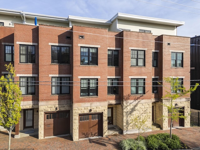 48 Federal St Unit B, Portland, ME 04101 - view of apartment building / complex featuring an attached garage and driveway