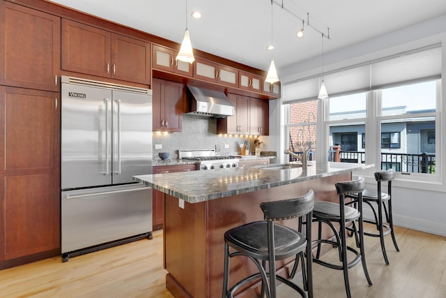 48 Federal St Unit B, Portland, ME 04101 - kitchen with stainless steel built in fridge, range hood, range, and light wood-type flooring