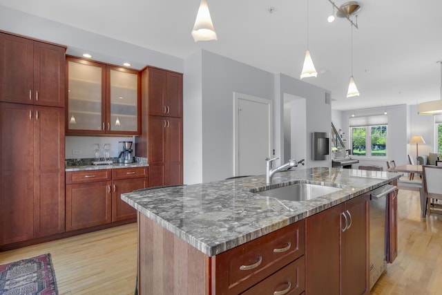 48 Federal St Unit B, Portland, ME 04101 - kitchen with a sink, light wood-style floors, hanging light fixtures, an island with sink, and open floor plan