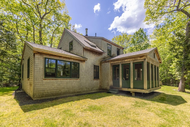 337 Washington St, Camden, ME 04843 - back of house featuring a sunroom, a yard, and a shingled roof