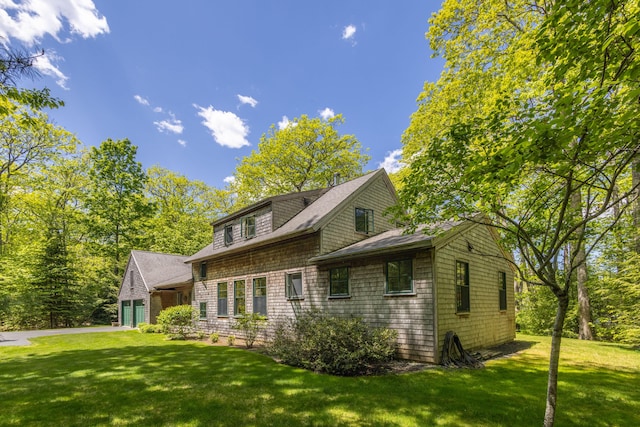 337 Washington St, Camden, ME 04843 - view of front of house featuring a front yard and roof with shingles