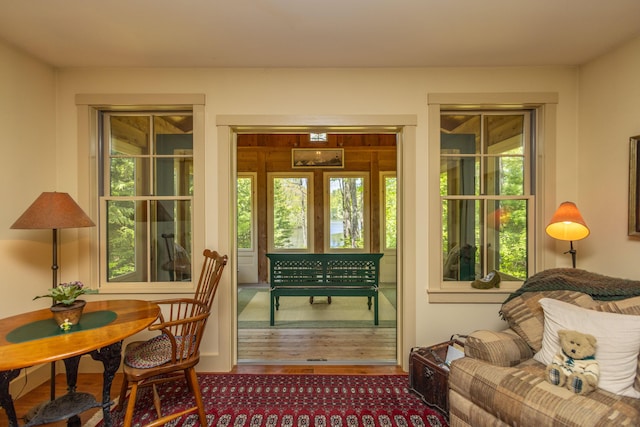 337 Washington St, Camden, ME 04843 - sitting room with plenty of natural light and wood finished floors