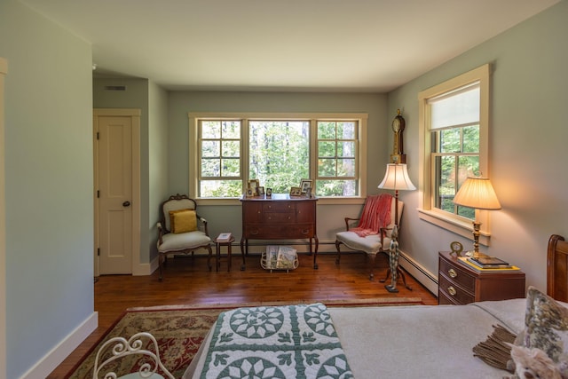 337 Washington St, Camden, ME 04843 - sitting room with wood finished floors, baseboards, and a baseboard heating unit