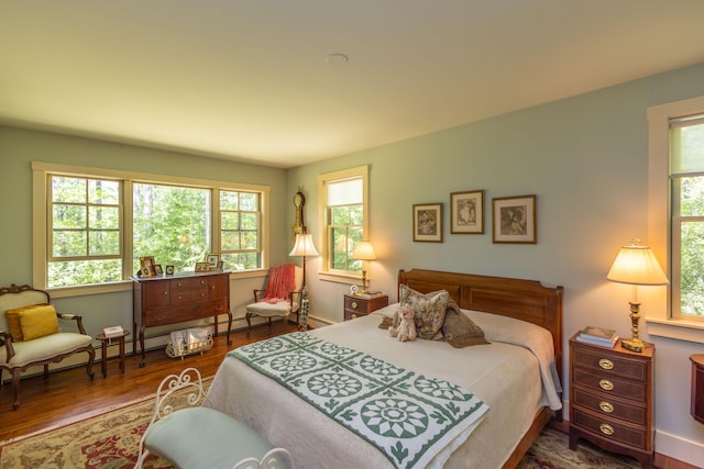 337 Washington St, Camden, ME 04843 - bedroom featuring multiple windows and wood finished floors