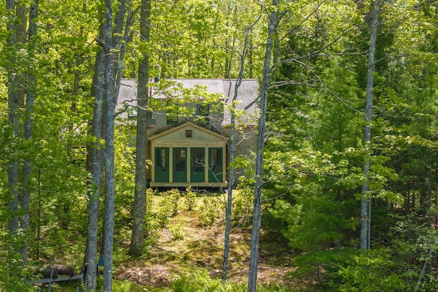 337 Washington St, Camden, ME 04843 - view of outdoor structure featuring a sunroom and a wooded view