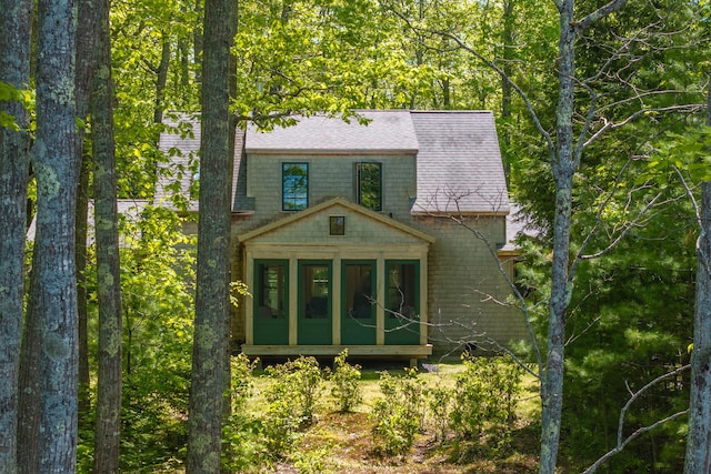337 Washington St, Camden, ME 04843 - back of property featuring a sunroom and a shingled roof