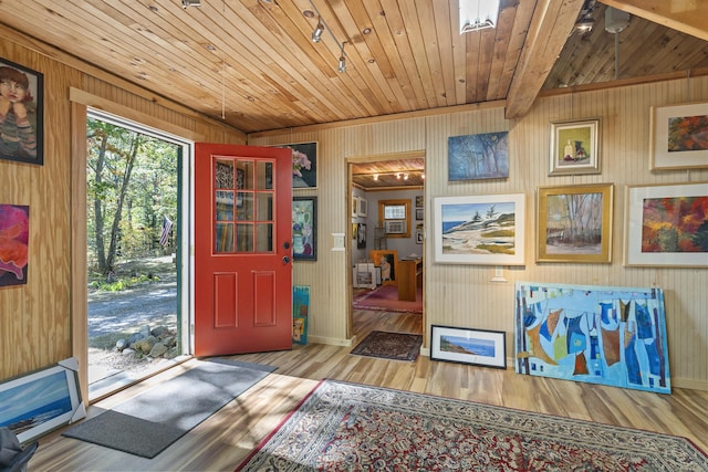 17 Spruce Meadow Ln, Jefferson, ME 04348 - entrance foyer featuring wood finished floors, wood walls, wooden ceiling, and baseboards