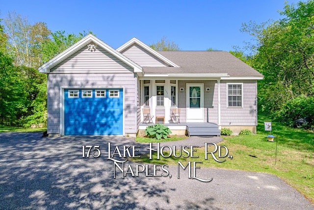 175 Lake House Rd, Naples, ME 04055 - ranch-style home featuring covered porch, an attached garage, driveway, and a front lawn