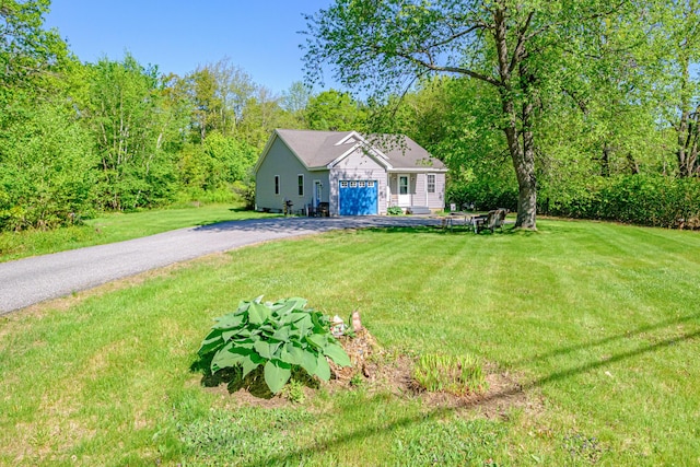 175 Lake House Rd, Naples, ME 04055 - view of front facade featuring driveway, a front yard, and an attached garage