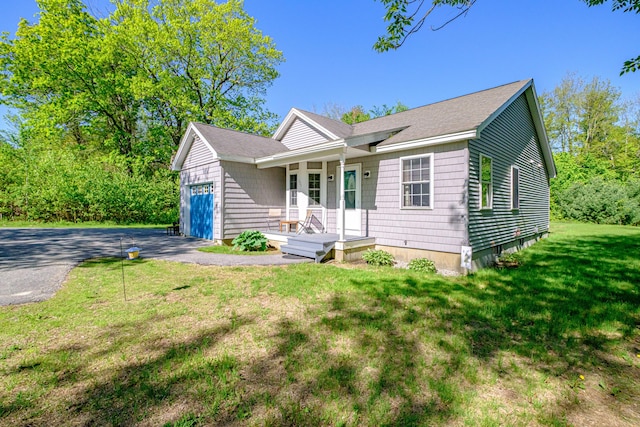 175 Lake House Rd, Naples, ME 04055 - ranch-style home with an attached garage, driveway, a front yard, and covered porch