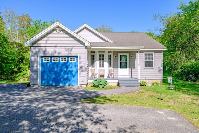 175 Lake House Rd, Naples, ME 04055 - ranch-style home featuring a porch, an attached garage, driveway, and a front yard