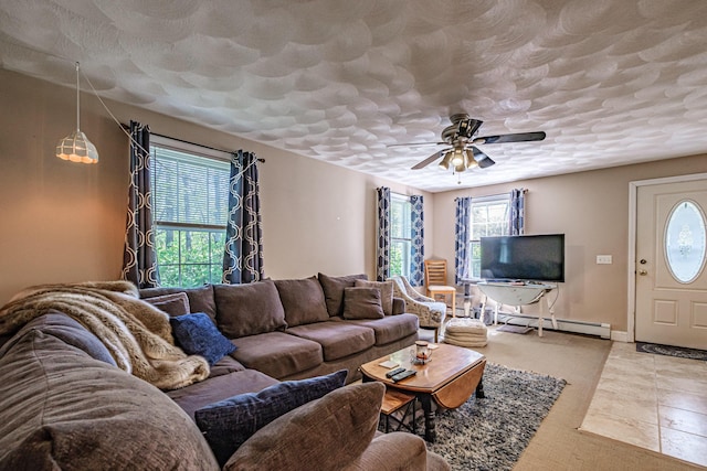 175 Lake House Rd, Naples, ME 04055 - living area featuring ceiling fan, a baseboard heating unit, baseboards, a textured ceiling, and tile patterned floors