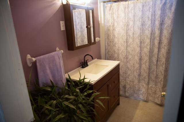 15 Lucille St, Saco, ME 04072 - bathroom featuring vanity, tile patterned floors, and curtained shower