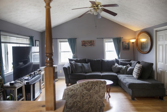 15 Lucille St, Saco, ME 04072 - living room with a ceiling fan, wood finished floors, lofted ceiling, a textured ceiling, and healthy amount of natural light
