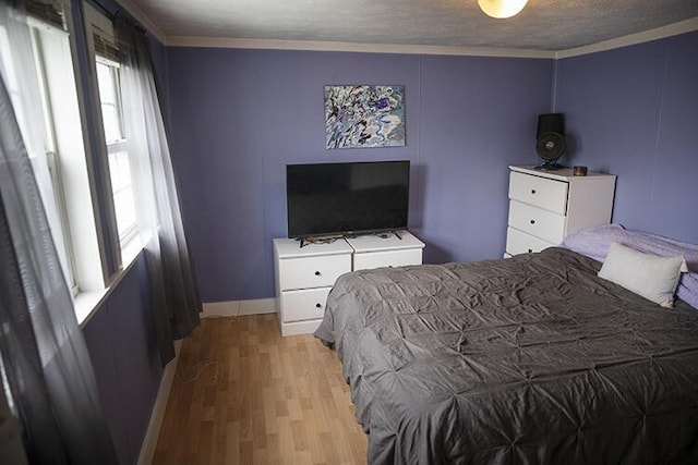 15 Lucille St, Saco, ME 04072 - bedroom with crown molding, light wood-style floors, and baseboards