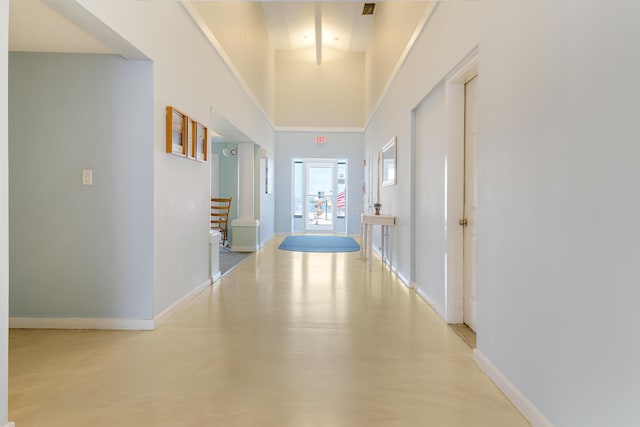 31 Ocean Ave Unit 105, York, ME 03909 - corridor featuring baseboards, a high ceiling, and finished concrete flooring