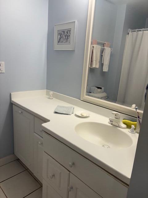 31 Ocean Ave Unit 105, York, ME 03909 - bathroom with vanity, tile patterned floors, and curtained shower