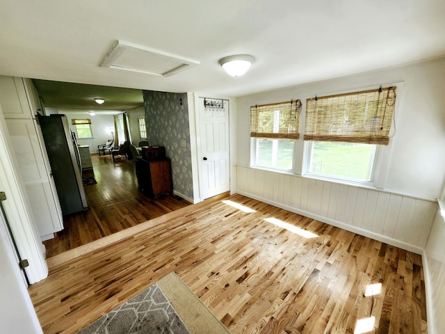 567 Ossipee Trl W, Standish, ME 04084 - unfurnished room with wood finished floors, attic access, a wainscoted wall, and wallpapered walls