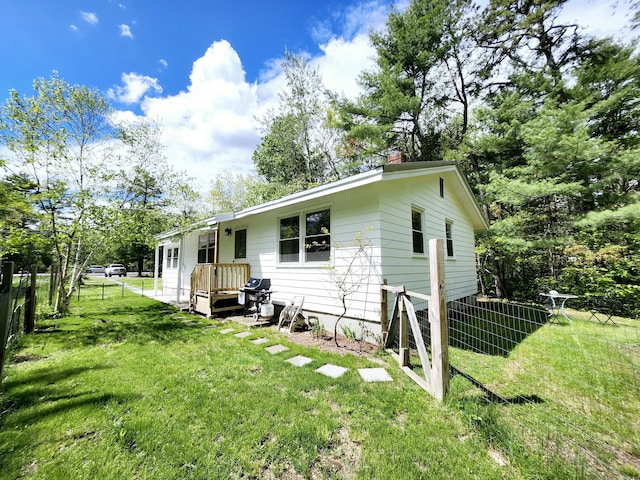 567 Ossipee Trl W, Standish, ME 04084 - rear view of house with a chimney