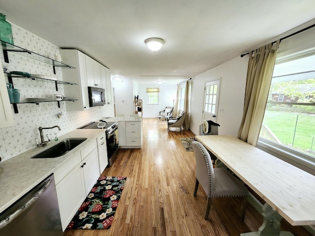 567 Ossipee Trl W, Standish, ME 04084 - kitchen with black microwave, open shelves, a sink, electric range, and stainless steel dishwasher