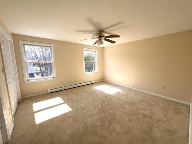 162 Beach St Unit 3, Saco, ME 04072 - unfurnished bedroom featuring a baseboard radiator, carpet floors, and baseboards