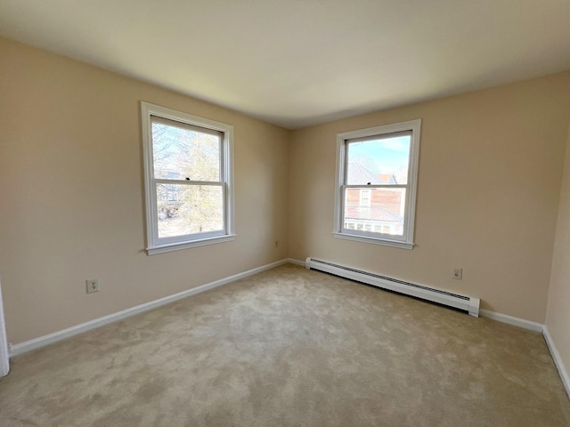 162 Beach St Unit 3, Saco, ME 04072 - carpeted spare room with baseboard heating, plenty of natural light, and baseboards