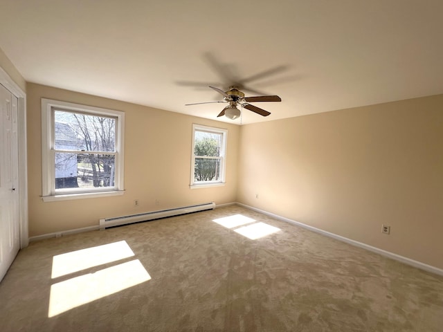 162 Beach St Unit 3, Saco, ME 04072 - unfurnished bedroom with a baseboard heating unit, carpet flooring, baseboards, and a closet