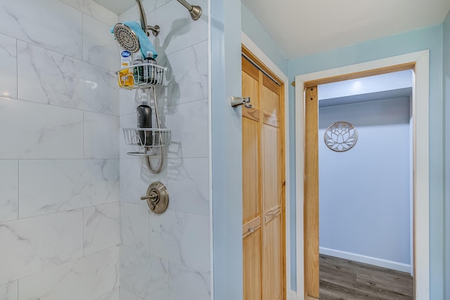 4 Dragonfly Cir, Limerick, ME 04048 - bathroom view of a tile shower, wood finished floors, and baseboards