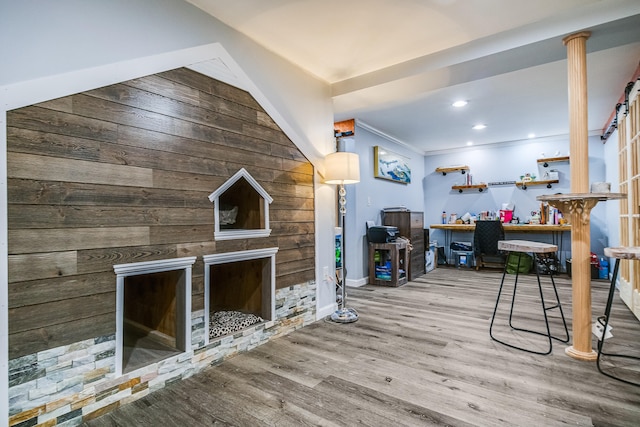 4 Dragonfly Cir, Limerick, ME 04048 - living room featuring a fireplace, wood finished floors, wood walls, and baseboards