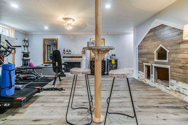 4 Dragonfly Cir, Limerick, ME 04048 - exercise area with a fireplace, ornamental molding, wood finished floors, recessed lighting, and wooden walls