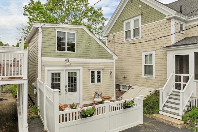 13 Ledge Rd Unit 3, Ogunquit, ME 03907 - rear view of house featuring roof with shingles
