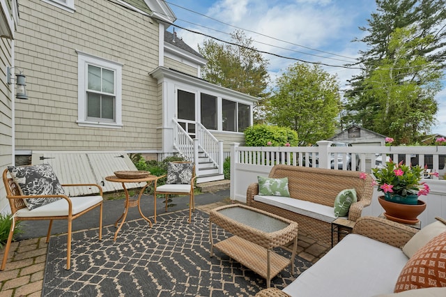 13 Ledge Rd Unit 3, Ogunquit, ME 03907 - wooden deck with a sunroom, an outdoor hangout area, and a patio