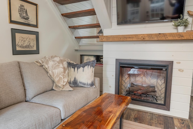 13 Ledge Rd Unit 3, Ogunquit, ME 03907 - living area featuring wood finished floors, a glass covered fireplace, and beam ceiling