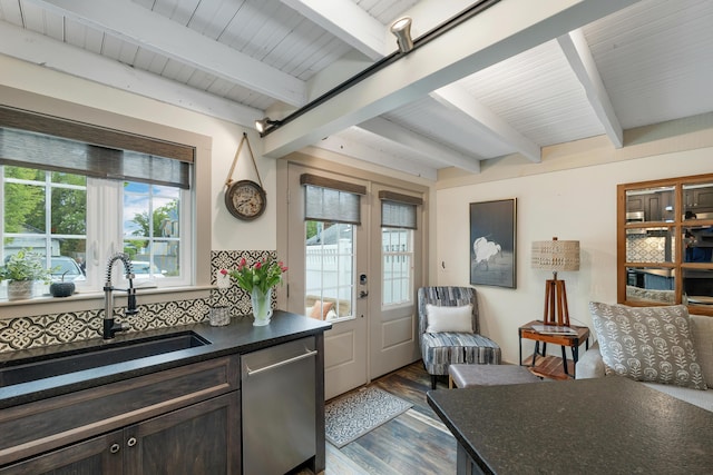 13 Ledge Rd Unit 3, Ogunquit, ME 03907 - kitchen featuring stainless steel dishwasher, beamed ceiling, plenty of natural light, dark wood-type flooring, and a sink