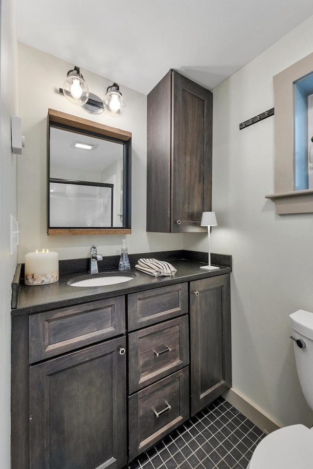 13 Ledge Rd Unit 3, Ogunquit, ME 03907 - bathroom with vanity, toilet, tile patterned flooring, and baseboards