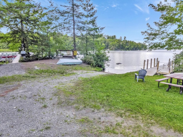 103 Taylor Woods Rd, Belgrade, ME 04917 - view of yard with a water view and a dock