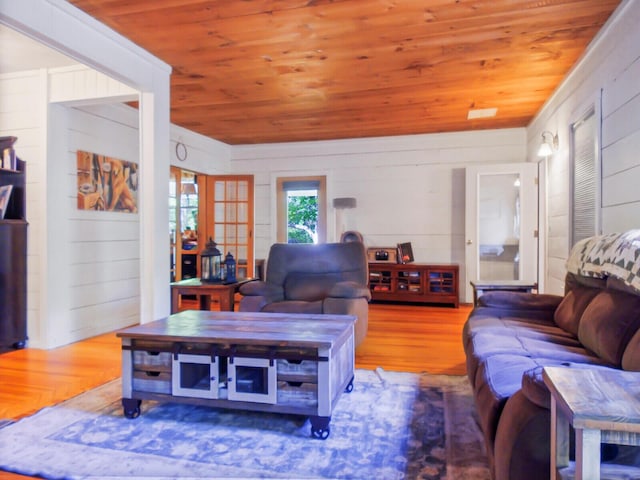 103 Taylor Woods Rd, Belgrade, ME 04917 - living area featuring wooden ceiling, wood finished floors, and wood walls
