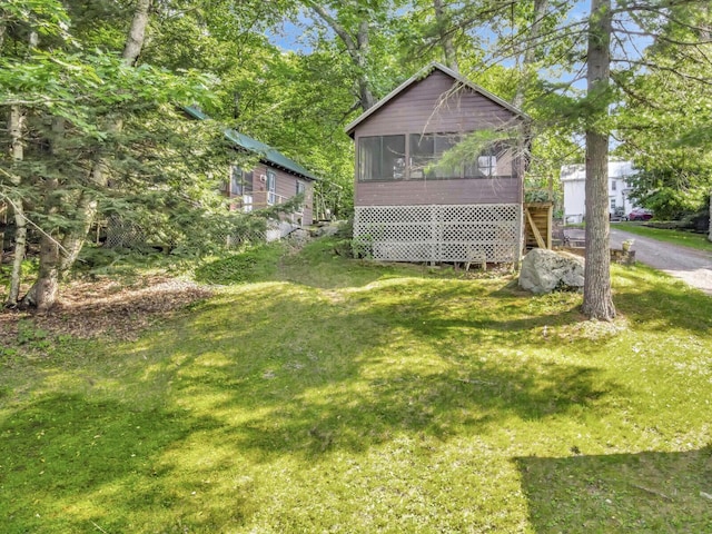 103 Taylor Woods Rd, Belgrade, ME 04917 - view of green lawn featuring a sunroom